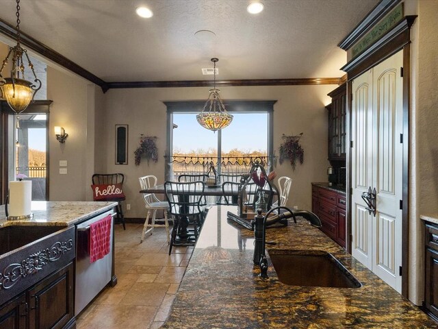 5451 Cottonwood Creek Cir, Norman, OK 73069 - kitchen featuring a sink, ornamental molding, stone tile flooring, stainless steel dishwasher, and pendant lighting