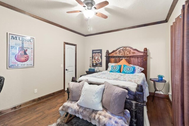 5451 Cottonwood Creek Cir, Norman, OK 73069 - bedroom with hardwood / wood-style floors, crown molding, baseboards, and ceiling fan