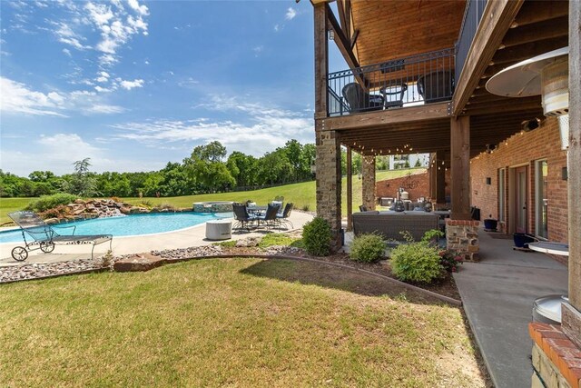 5451 Cottonwood Creek Cir, Norman, OK 73069 - view of green lawn with a balcony, a patio area, an outdoor living space, and a pool with connected hot tub
