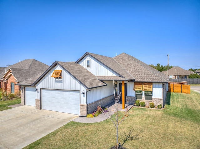 craftsman-style home with a front lawn and a garage