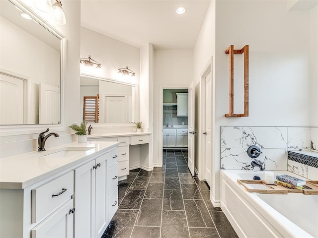 bathroom with a bathtub and vanity