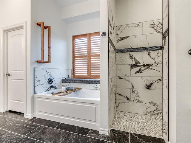 bathroom featuring separate shower and tub