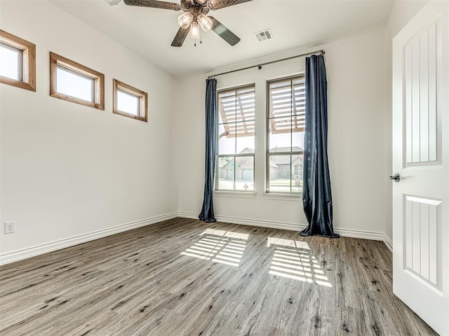 unfurnished room with light hardwood / wood-style floors and ceiling fan