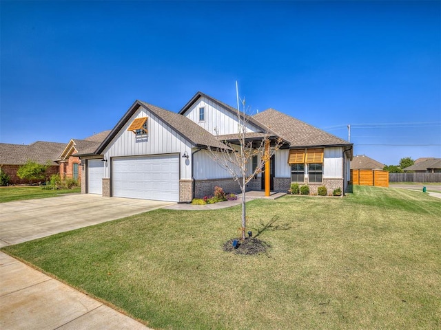 view of front of property featuring a front lawn and a garage