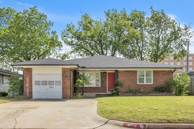 ranch-style home featuring a garage and a front lawn