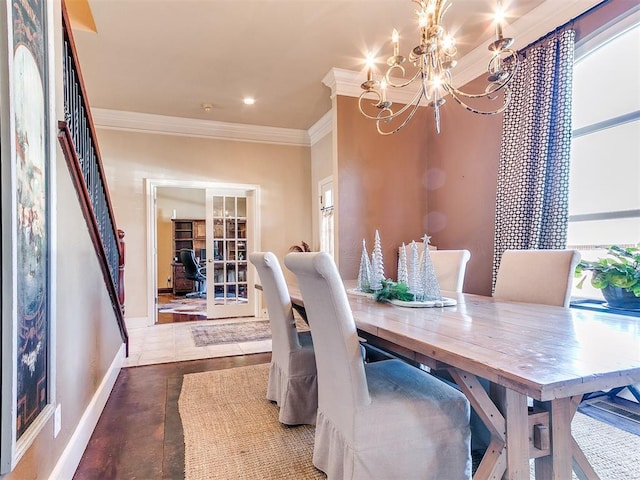 tiled dining area with crown molding and a chandelier