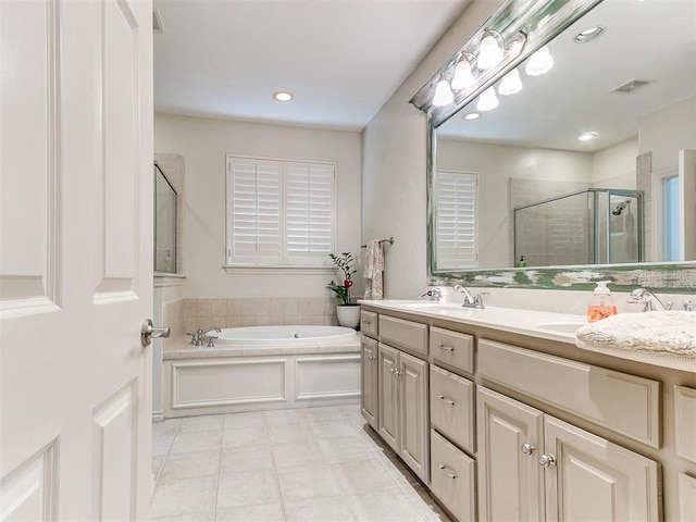 bathroom with shower with separate bathtub and vanity