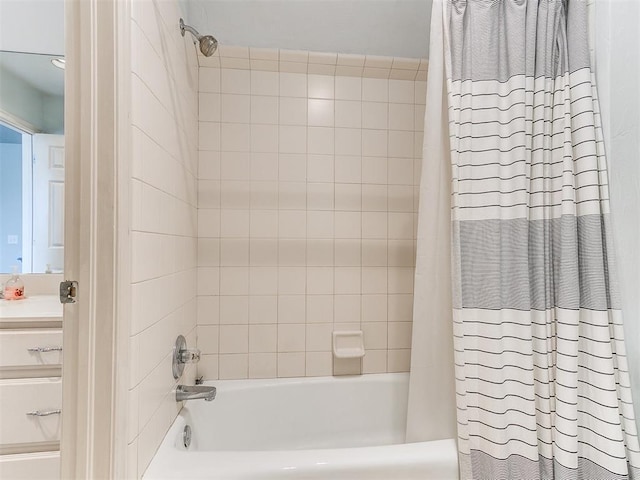 bathroom with shower / tub combo with curtain