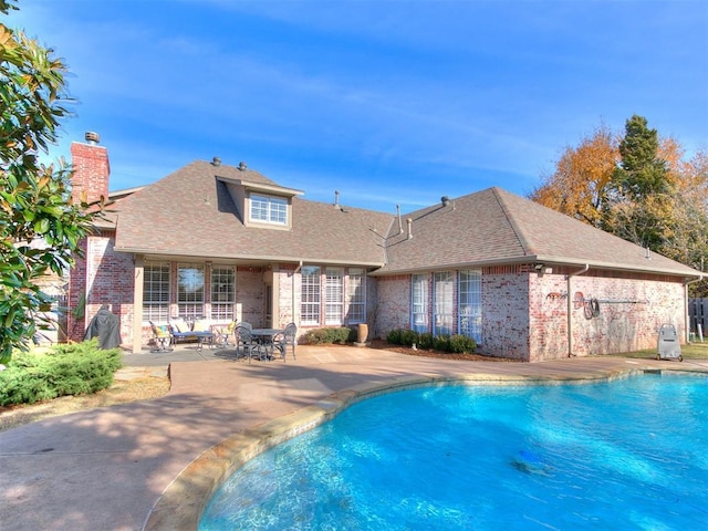 view of pool with a patio area