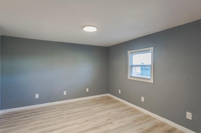 spare room featuring light hardwood / wood-style floors