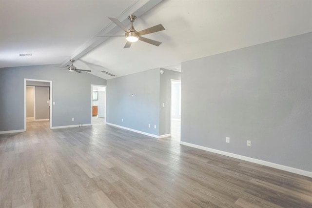 spare room featuring hardwood / wood-style flooring, lofted ceiling with beams, and ceiling fan