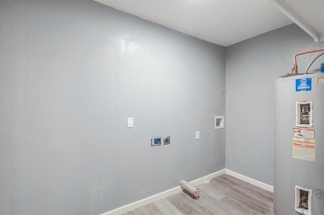 laundry area with hookup for an electric dryer, hookup for a washing machine, electric water heater, and light hardwood / wood-style flooring