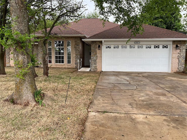 ranch-style house featuring a garage