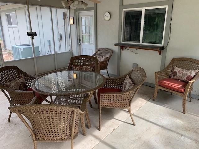 balcony featuring central AC unit and a patio area