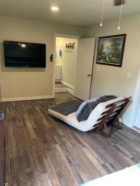 living room featuring dark wood-type flooring