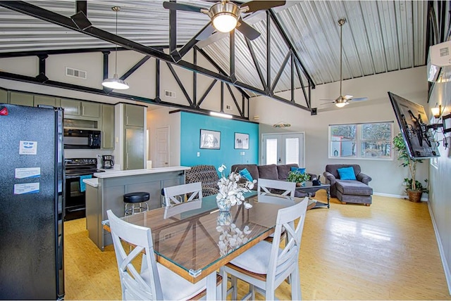 dining space with light hardwood / wood-style flooring, lofted ceiling with beams, french doors, and ceiling fan