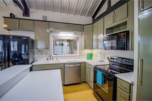 kitchen featuring sink, lofted ceiling with beams, black appliances, and light wood-type flooring