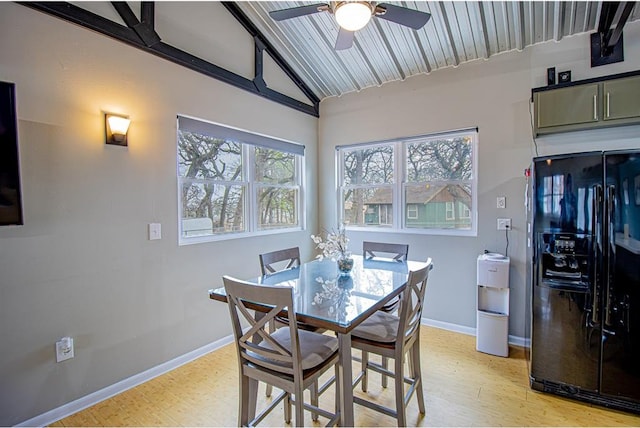 dining room with lofted ceiling, light wood-type flooring, and ceiling fan