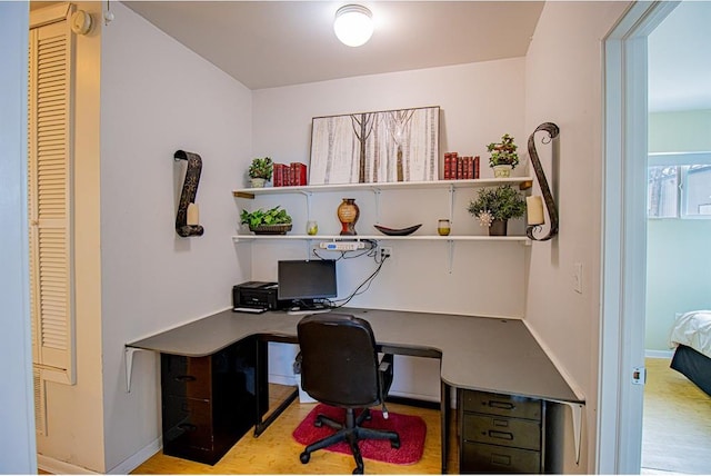 office with light hardwood / wood-style flooring