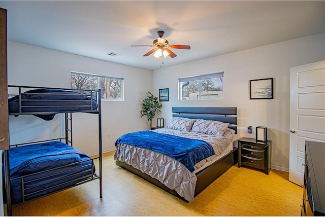 bedroom featuring ceiling fan and light hardwood / wood-style floors