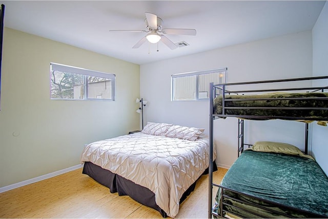 bedroom featuring hardwood / wood-style flooring and ceiling fan