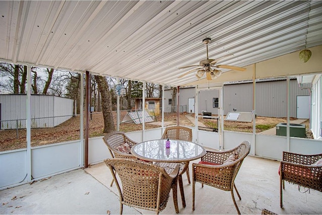 sunroom / solarium with vaulted ceiling and ceiling fan