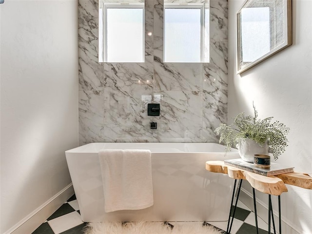 bathroom featuring a tub to relax in