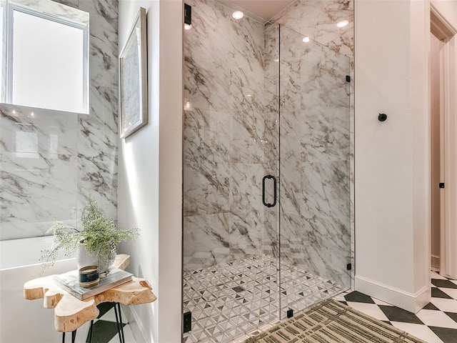 bathroom featuring a shower with shower door