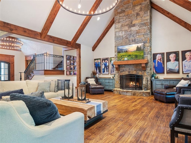 living room with high vaulted ceiling, a stone fireplace, a notable chandelier, beam ceiling, and wood-type flooring