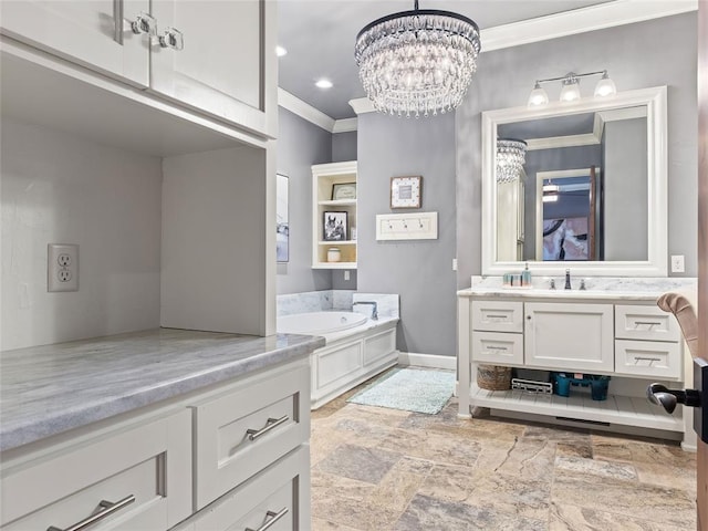 bathroom featuring a notable chandelier, vanity, a bathing tub, and crown molding