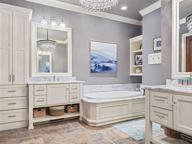 bathroom with a washtub, built in features, a chandelier, vanity, and ornamental molding