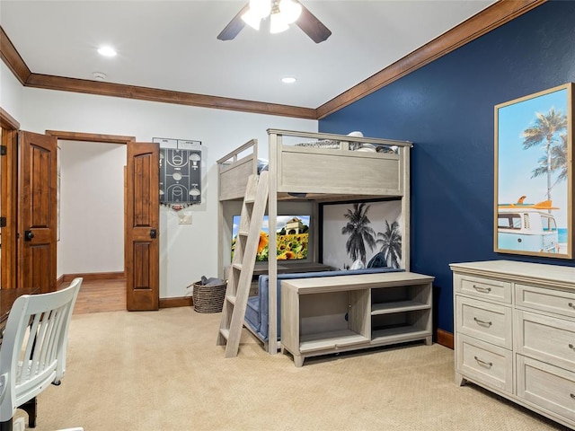 carpeted bedroom featuring ceiling fan and ornamental molding