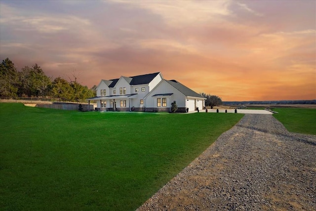 view of front of house with a yard