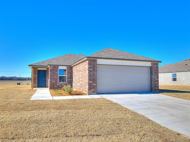 ranch-style home featuring a garage and a front lawn