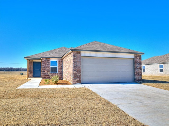 ranch-style home with a garage and a front yard