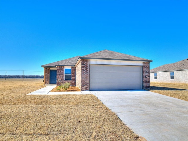 view of front of home featuring a garage and a front lawn