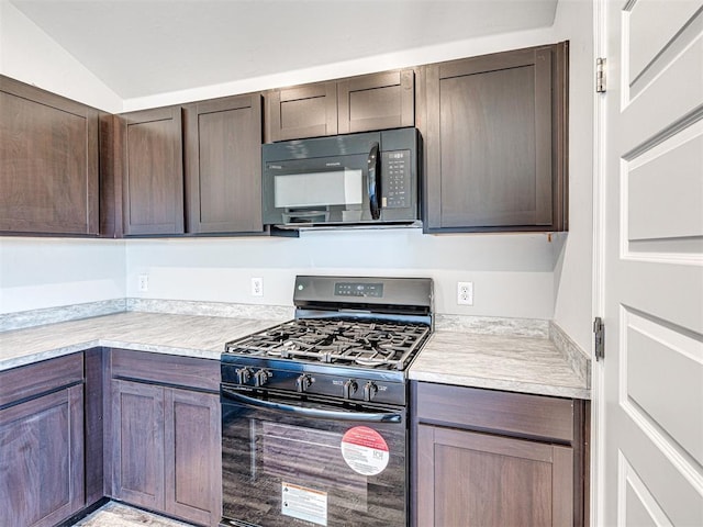 kitchen featuring dark brown cabinets and black appliances