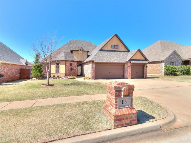 view of front of home featuring a garage and a front yard