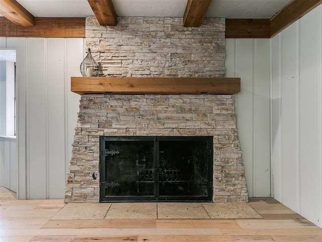 details with wood walls, a fireplace, and hardwood / wood-style flooring