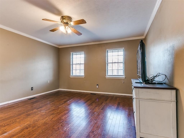 unfurnished living room with ornamental molding, ceiling fan, and dark wood-type flooring