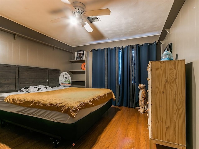 bedroom featuring ceiling fan and wood-type flooring