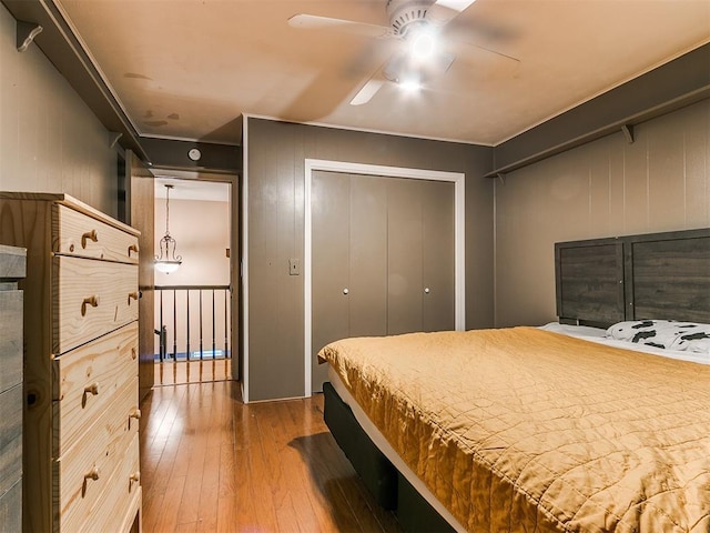 bedroom with ceiling fan and hardwood / wood-style floors