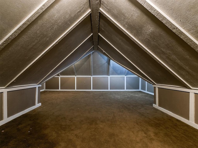 bonus room featuring vaulted ceiling