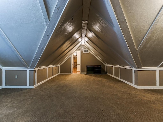 bonus room featuring carpet flooring and lofted ceiling