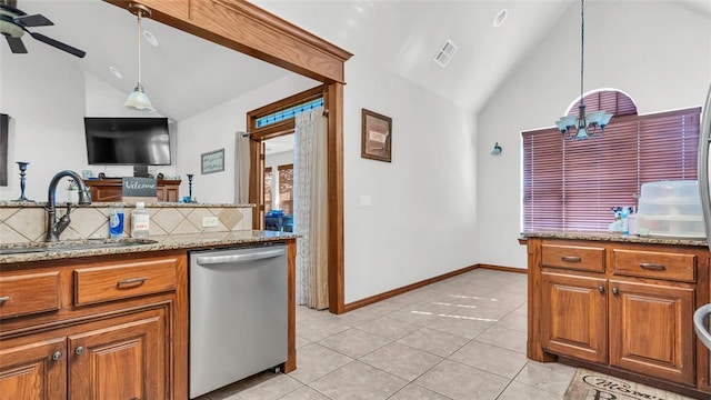 kitchen with decorative backsplash, light stone countertops, vaulted ceiling, sink, and dishwasher