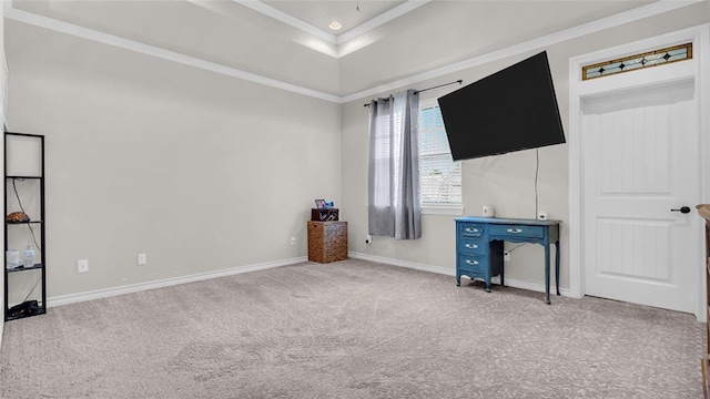 unfurnished bedroom with light colored carpet, ornamental molding, and a tray ceiling