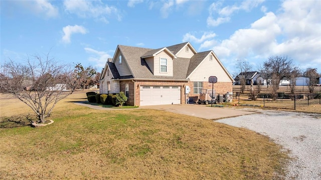 view of front of property featuring a garage and a front lawn