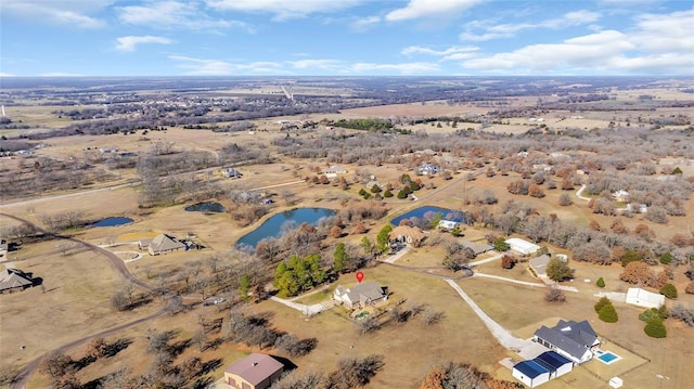 bird's eye view featuring a rural view and a water view