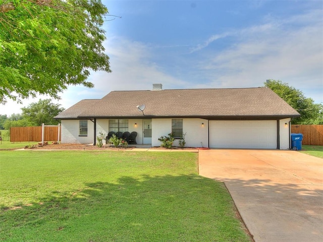 ranch-style home with a front yard and a garage