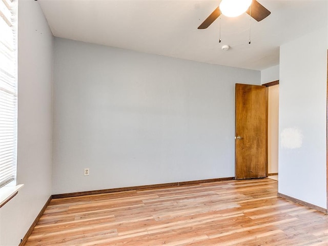 spare room featuring ceiling fan and light hardwood / wood-style floors